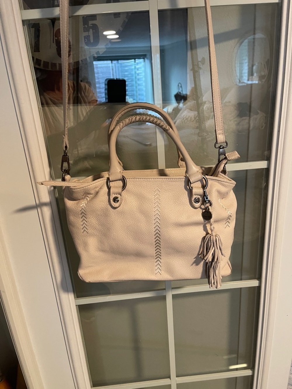 The Sak Cream Leather Satchel with Tassel Charm